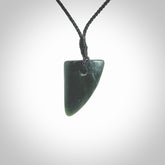 This is a lovely New Zealand Jade, pounamu drop pendant. It is bound with an adjustable Black coloured cord which is length adjustable.